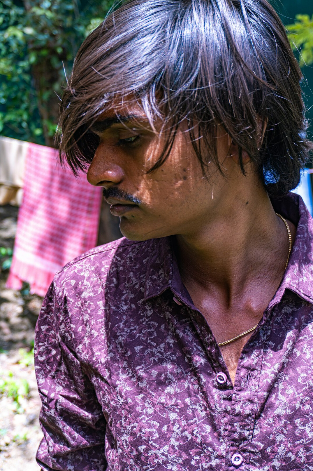 Indigenous man with short hair in outdoor portrait