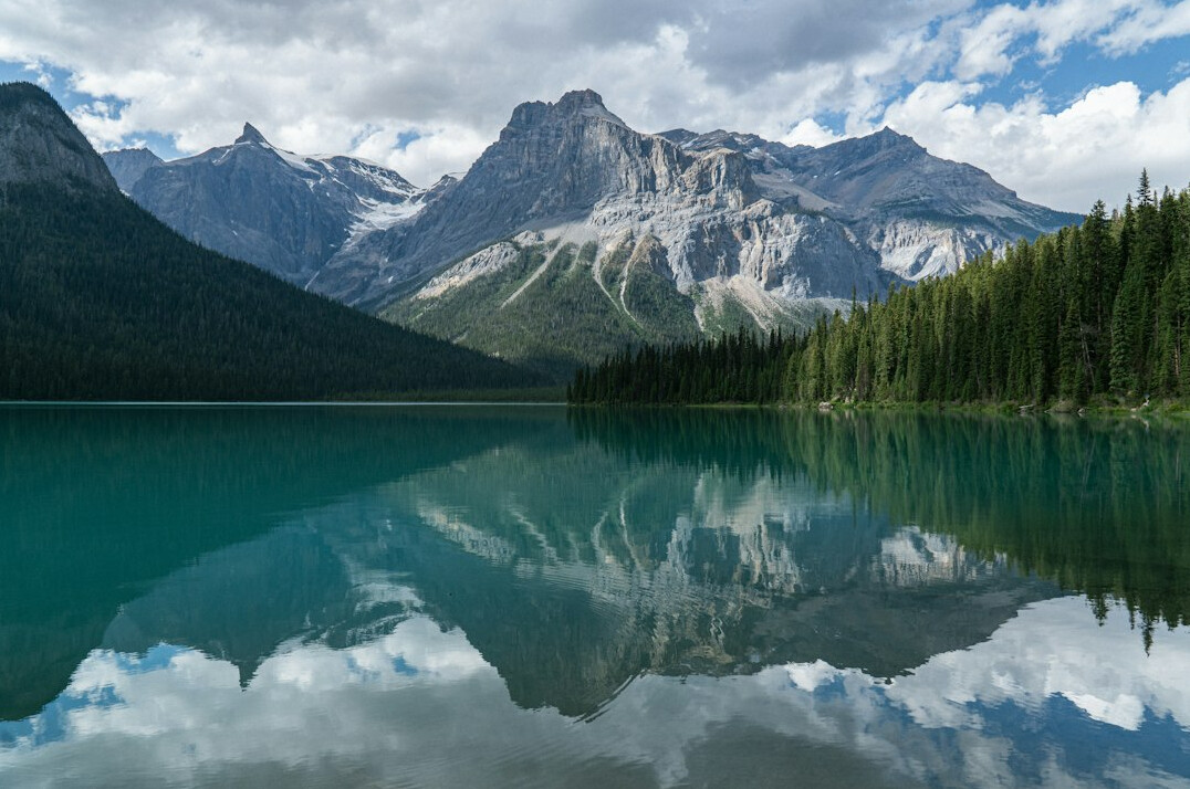 Canadian Rocky Mountains reflected in a turquoise lake