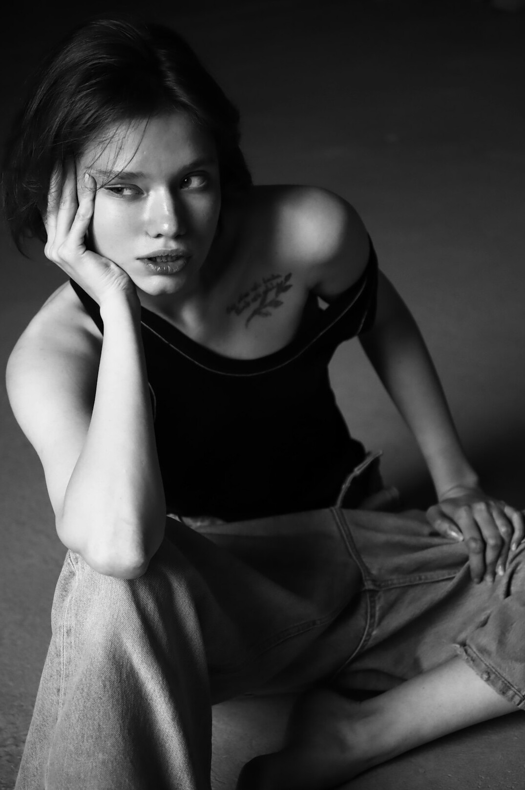 Asian woman with short hair smiling in studio portrait